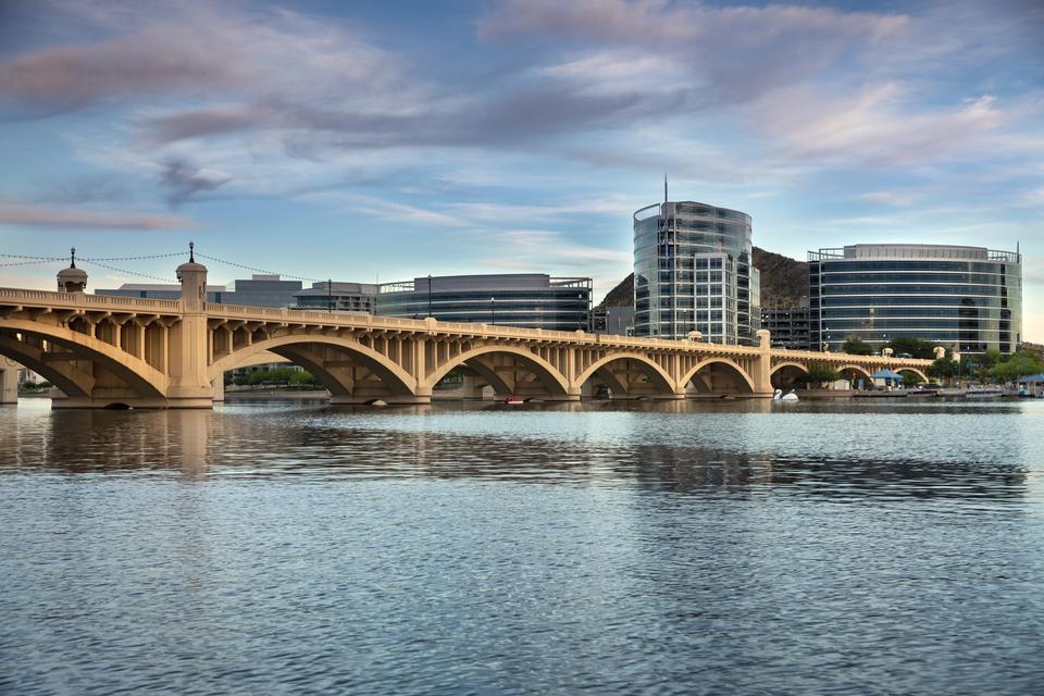 Phoenix, Arizona - April 8, 2019: Cityscape shore view of downtown Tempe Arizona USA over the Salt River and Mill Avenue Bridge